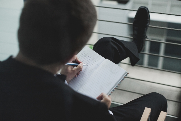 groom and bride getting ready together in the same room