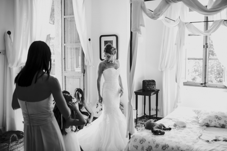 bride putting on her dress