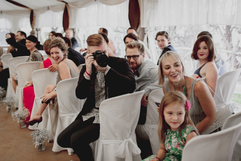 guests taking picture of the bride