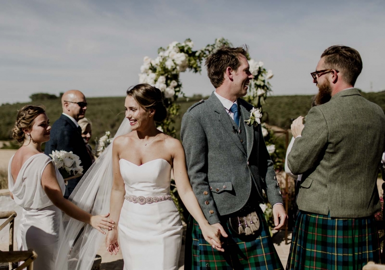 Bride and groom walking down aisle after wedding ceremony