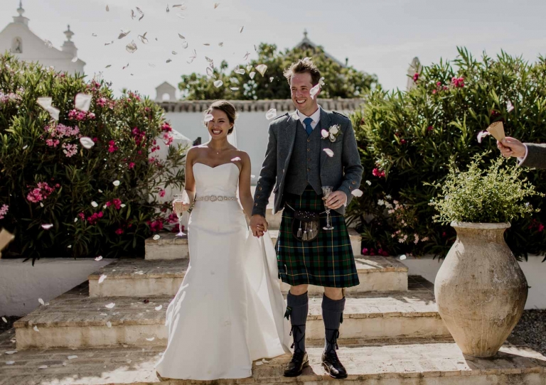Bride and groom walking down aisle after wedding ceremony