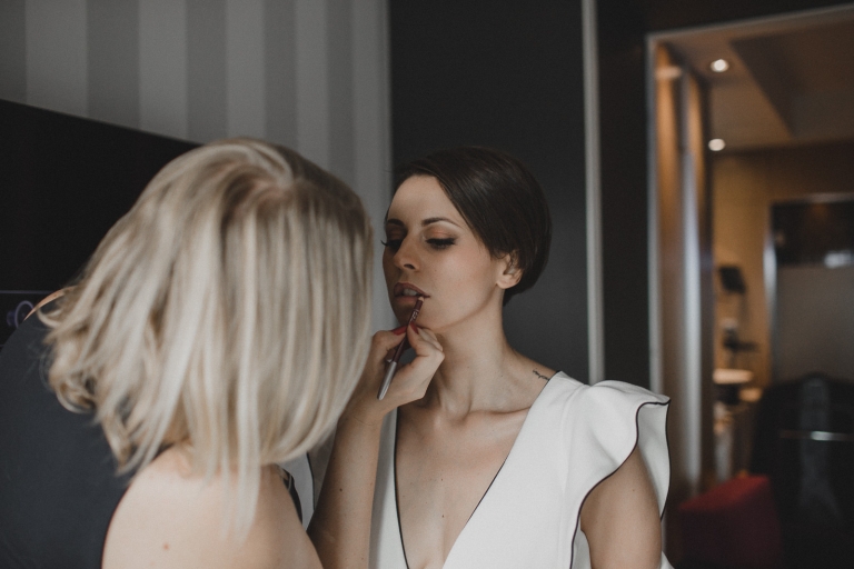 bride doing her makeup
