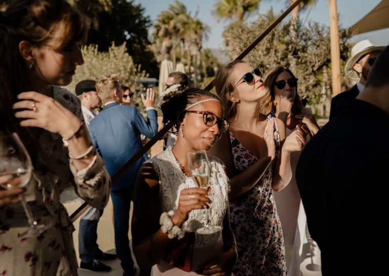 bride and groom with the guests in the beach club