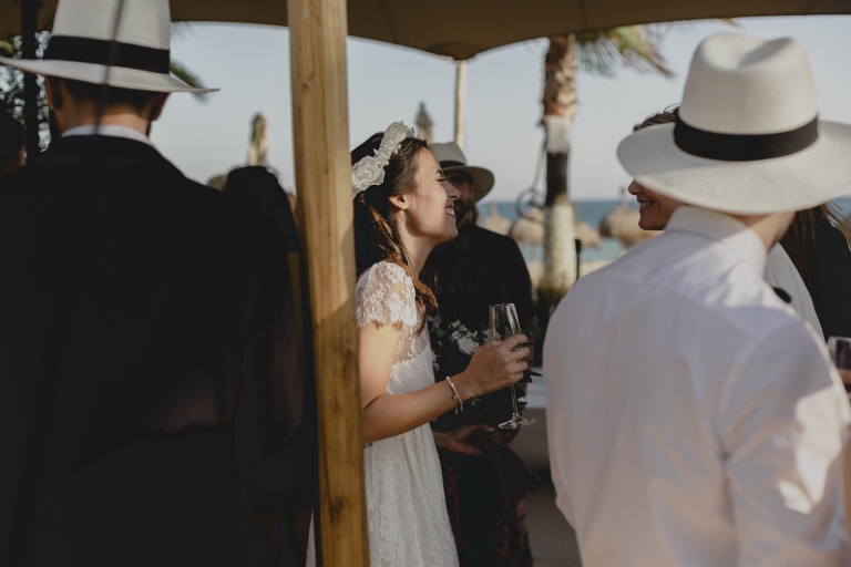 bride and groom with the guests in the beach club