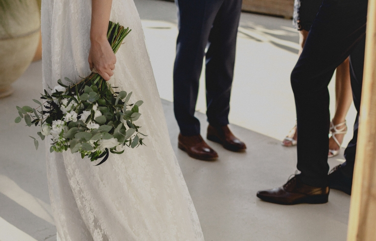bride and groom with the guests in the beach club