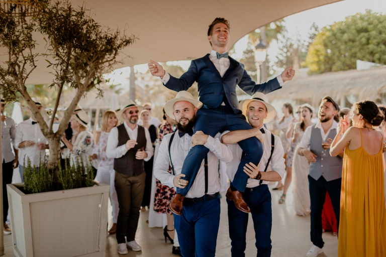 the groom dancing with the guests