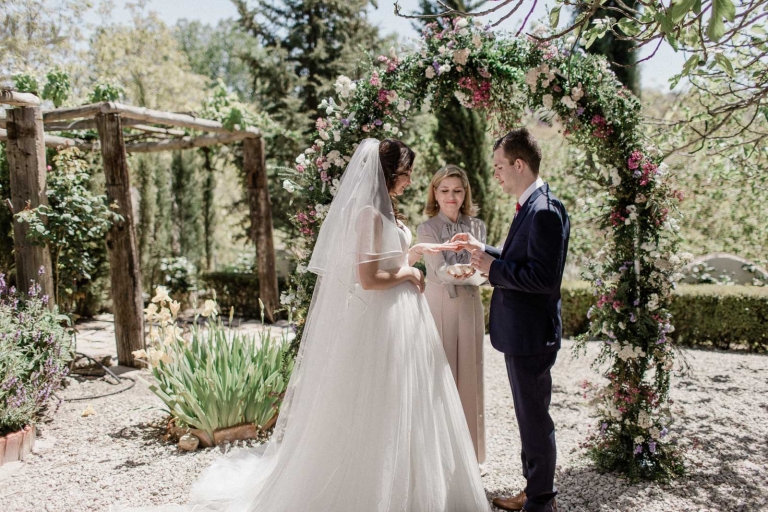 couple exchanging rings during wedding ceremony