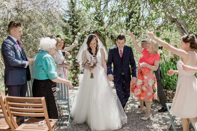 Bride and groom walking down aisle after their ceremony